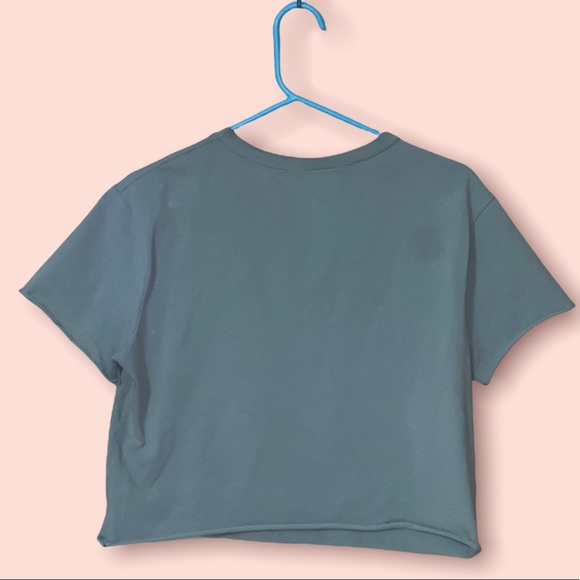 A crop top. Ripped from the center. Design  is Rock - Picture 3 of 6